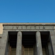 Word latin IUSTITIA in front of a tribunal facade, Justice in latin
